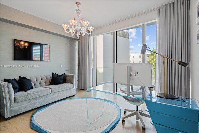 living room with a notable chandelier and light wood-type flooring