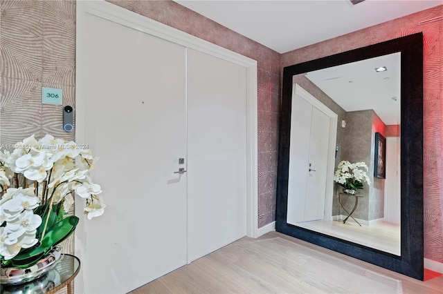 foyer entrance with hardwood / wood-style flooring