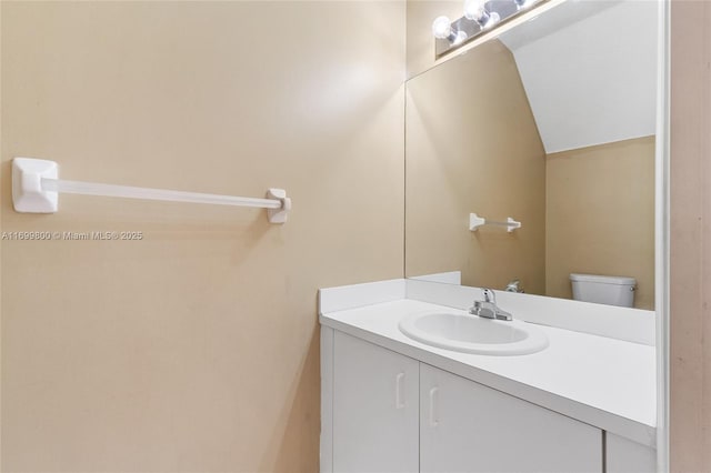 bathroom featuring toilet and vanity