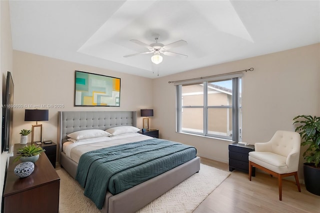 bedroom with ceiling fan and light wood-type flooring