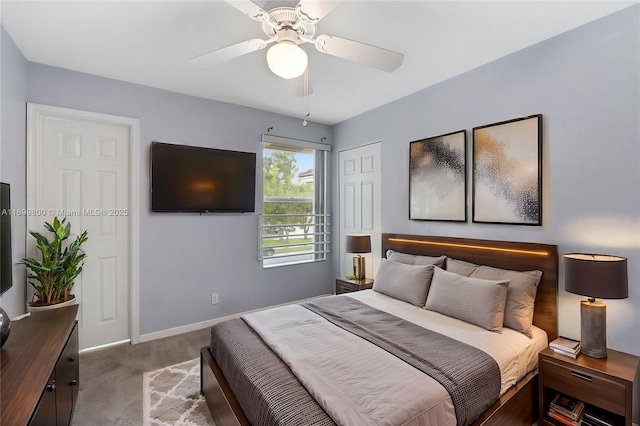 bedroom with ceiling fan, carpet, and a closet