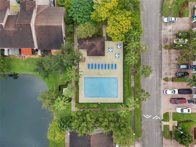 birds eye view of property with a water view