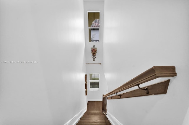 stairs with wood-type flooring