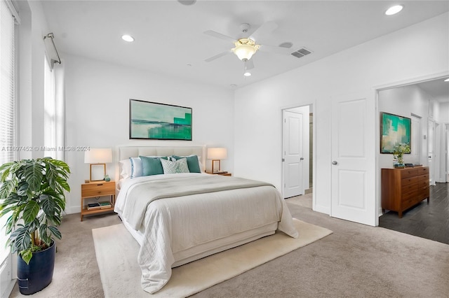 carpeted bedroom with ceiling fan