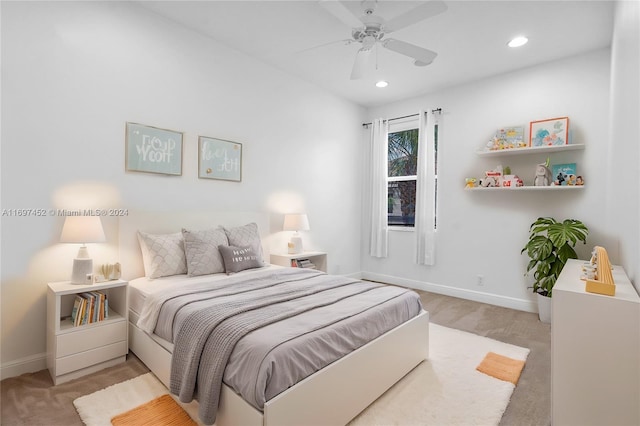 carpeted bedroom featuring ceiling fan