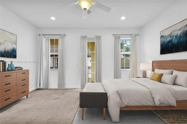 bedroom featuring ceiling fan and light colored carpet