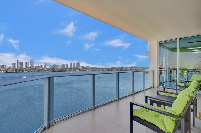 balcony featuring a water view