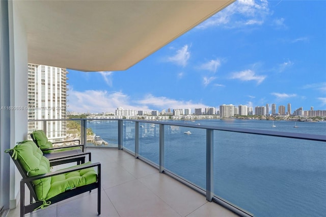 balcony featuring a water view