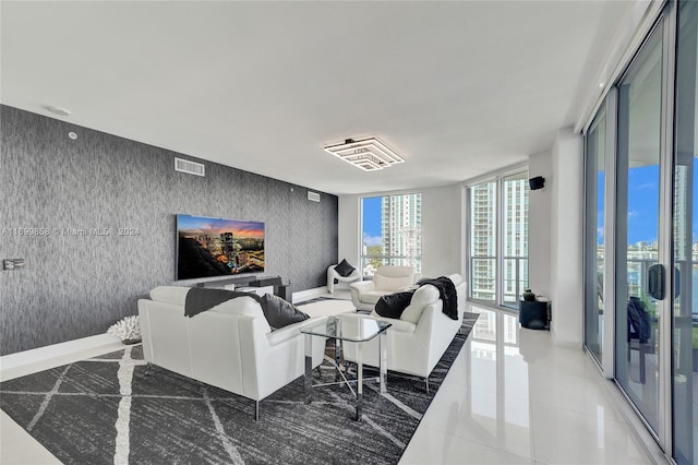 living room with tile patterned floors and expansive windows