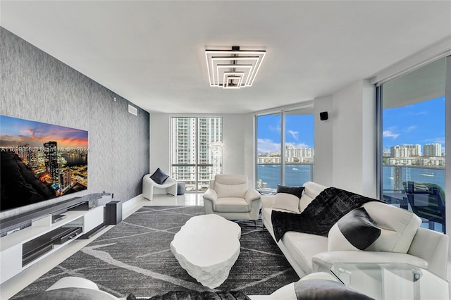 living room with a water view and expansive windows