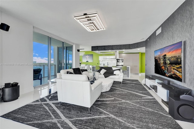 living room with floor to ceiling windows and a water view