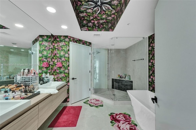 bathroom with tile patterned floors, vanity, and separate shower and tub