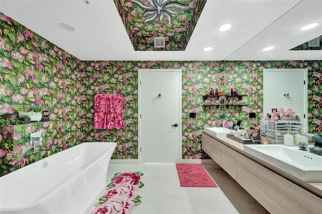 bathroom featuring a bath, vanity, and tile patterned floors