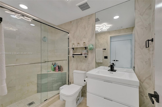 bathroom featuring walk in shower, vanity, and toilet