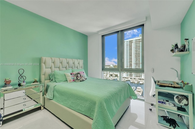 bedroom featuring a wall of windows