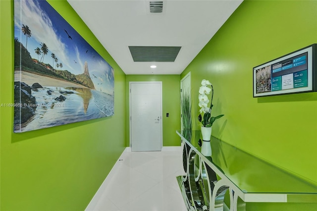 hall featuring light tile patterned floors