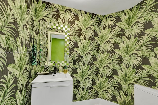 bathroom with vanity and toilet