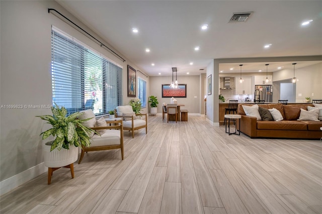 living room with light hardwood / wood-style floors