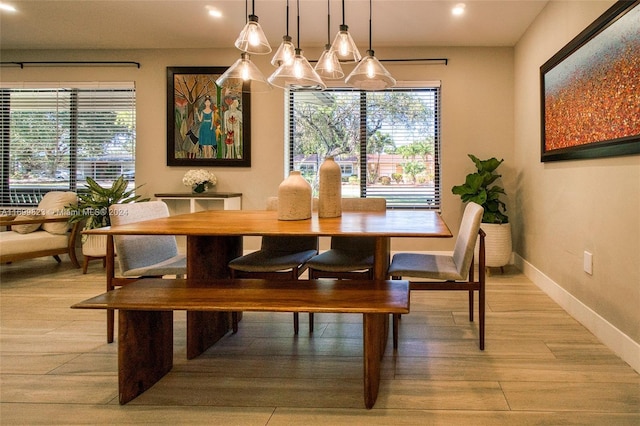 dining area featuring a chandelier and light hardwood / wood-style flooring