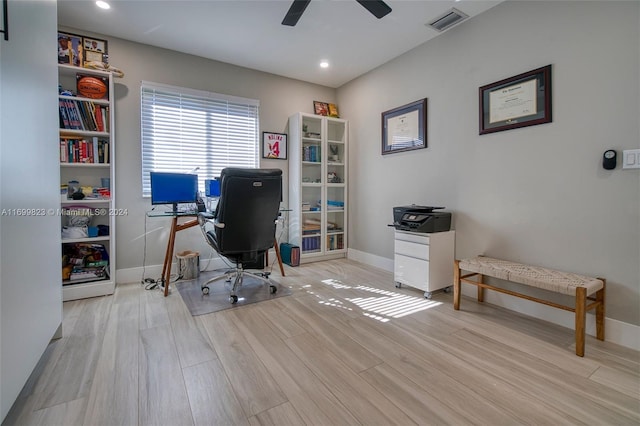 office area with light hardwood / wood-style flooring and ceiling fan