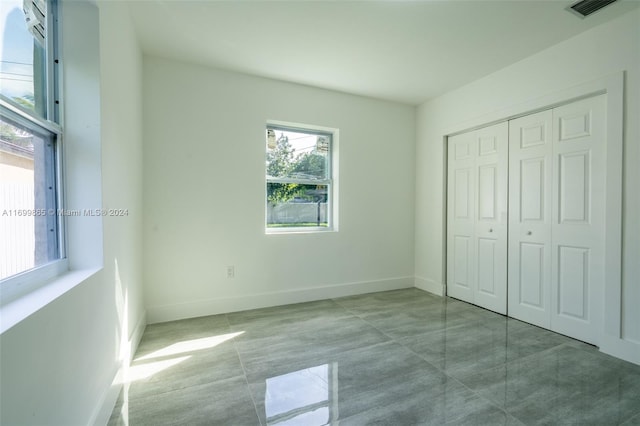 unfurnished bedroom featuring a closet