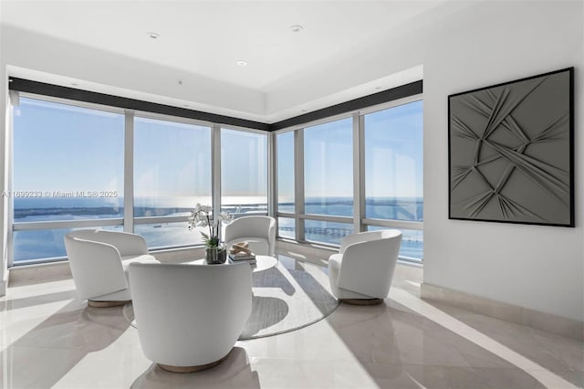 dining space with a water view