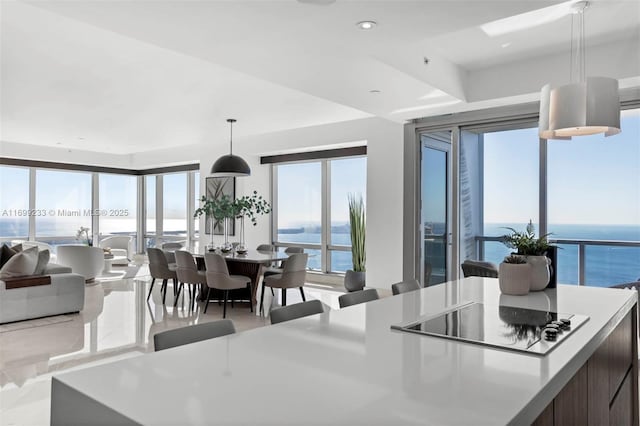 dining area featuring a water view