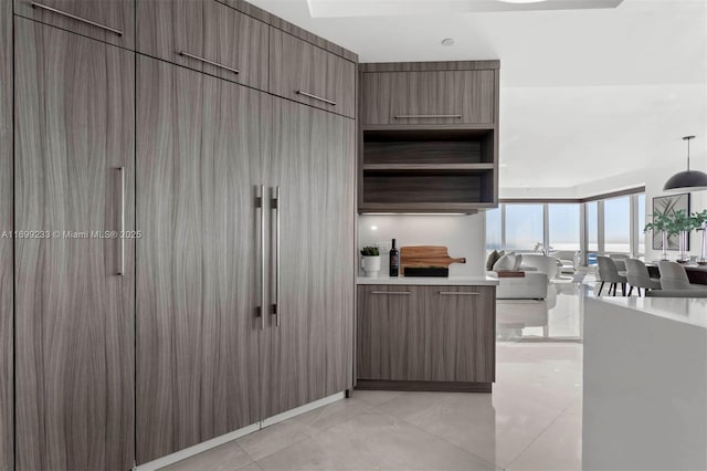 kitchen featuring decorative light fixtures and light tile patterned floors