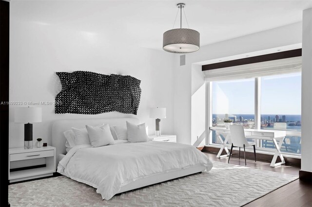 bedroom with wood-type flooring