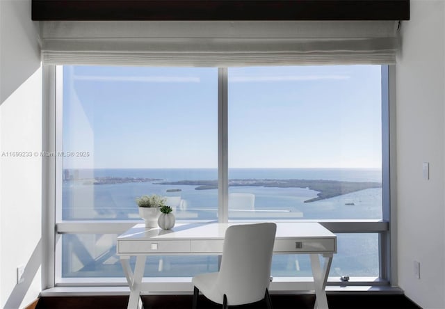 dining space featuring a water view