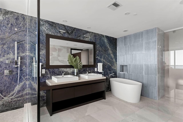 bathroom with vanity, plus walk in shower, and tile walls