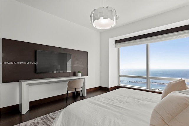 bedroom featuring dark hardwood / wood-style flooring