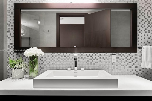 bathroom featuring vanity, tile walls, and backsplash