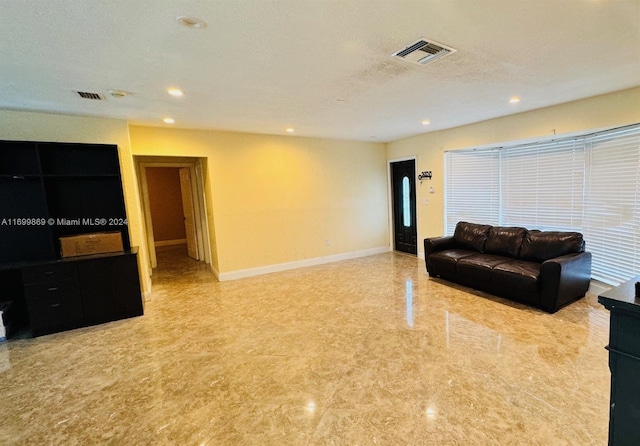 living room with a textured ceiling