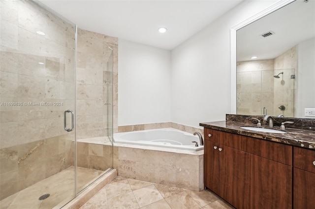 bathroom with separate shower and tub and vanity