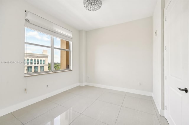 spare room featuring light tile patterned floors