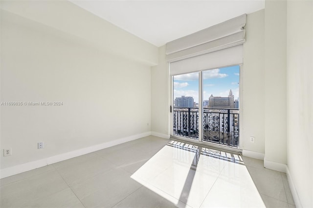 spare room with light tile patterned floors