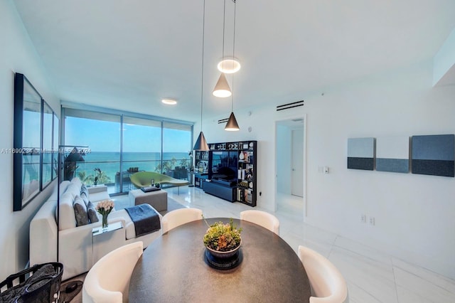 dining room with floor to ceiling windows