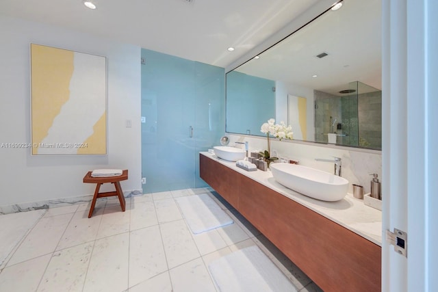 bathroom featuring vanity and an enclosed shower