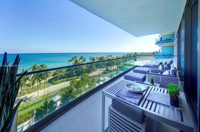 balcony featuring a water view