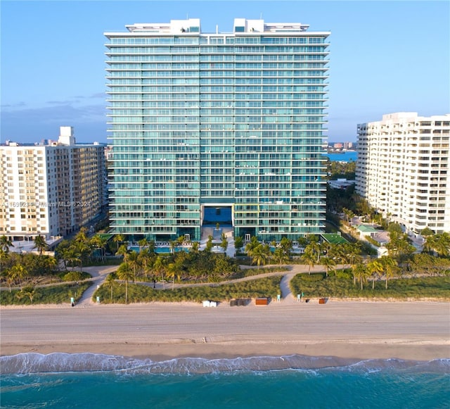 view of property featuring a view of the beach and a water view