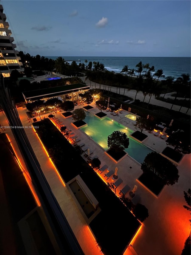 aerial view at dusk with a water view