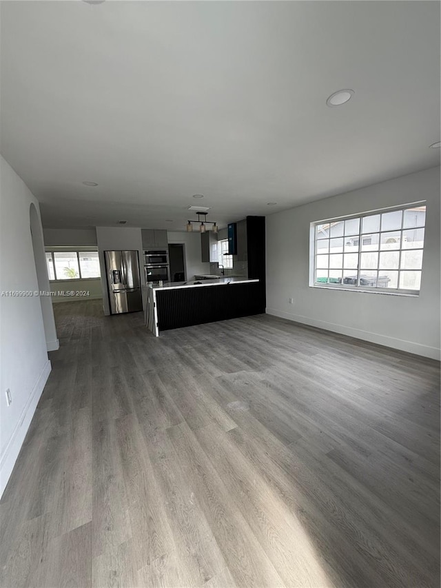 unfurnished living room with light hardwood / wood-style floors