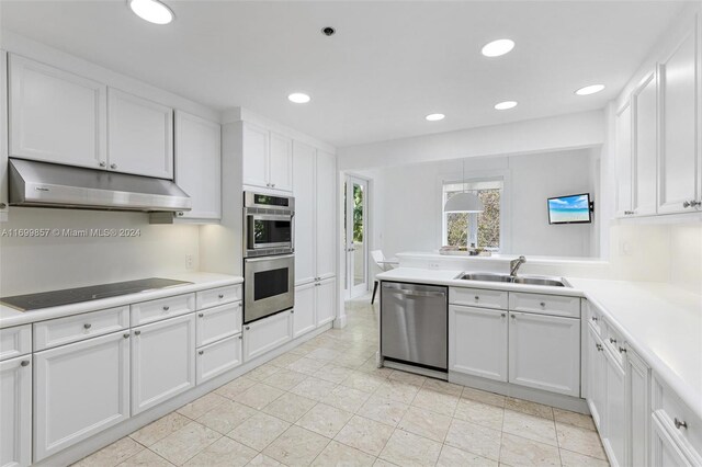 kitchen with white cabinetry, sink, and appliances with stainless steel finishes