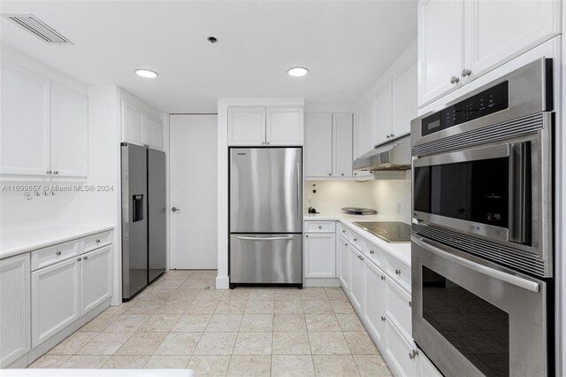 kitchen featuring white cabinetry, light tile patterned floors, and stainless steel appliances