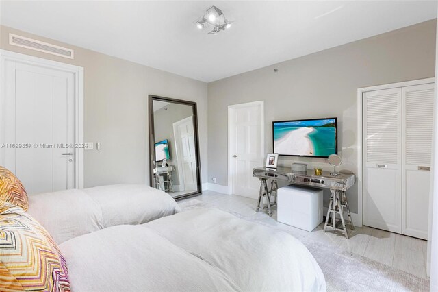 bedroom with light wood-type flooring