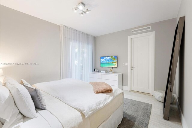 bedroom with light wood-type flooring