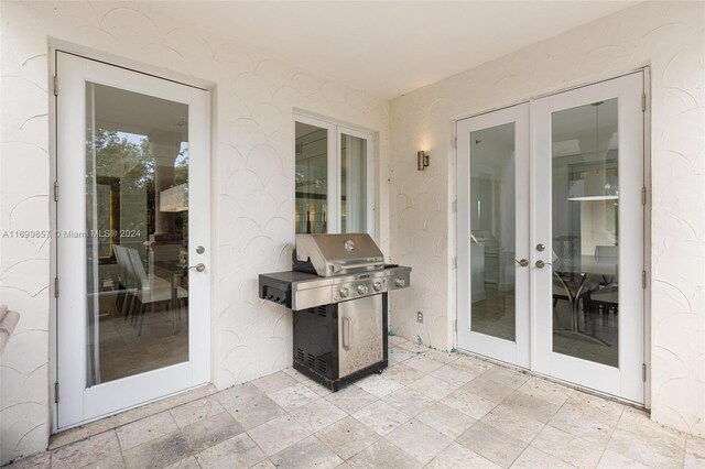 view of patio with area for grilling and french doors