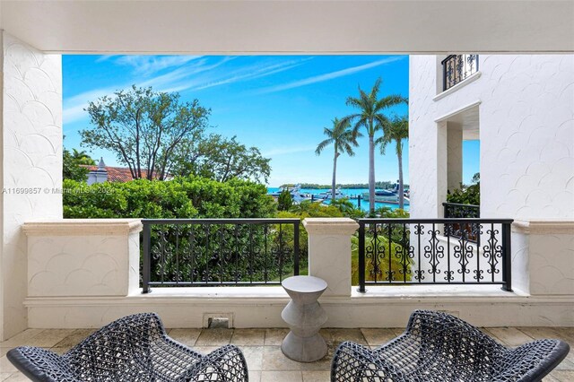 balcony featuring a water view