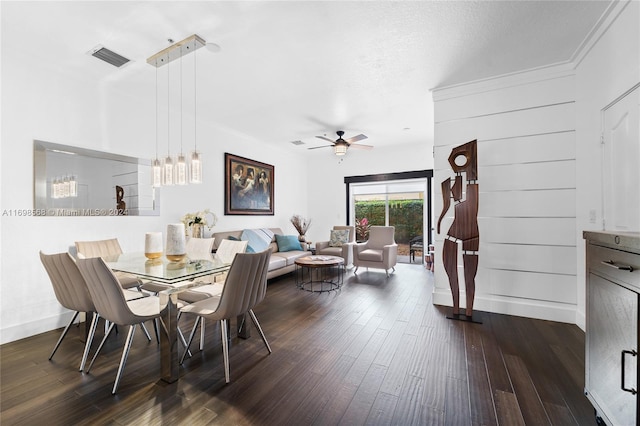 dining room with ceiling fan, dark hardwood / wood-style flooring, and ornamental molding